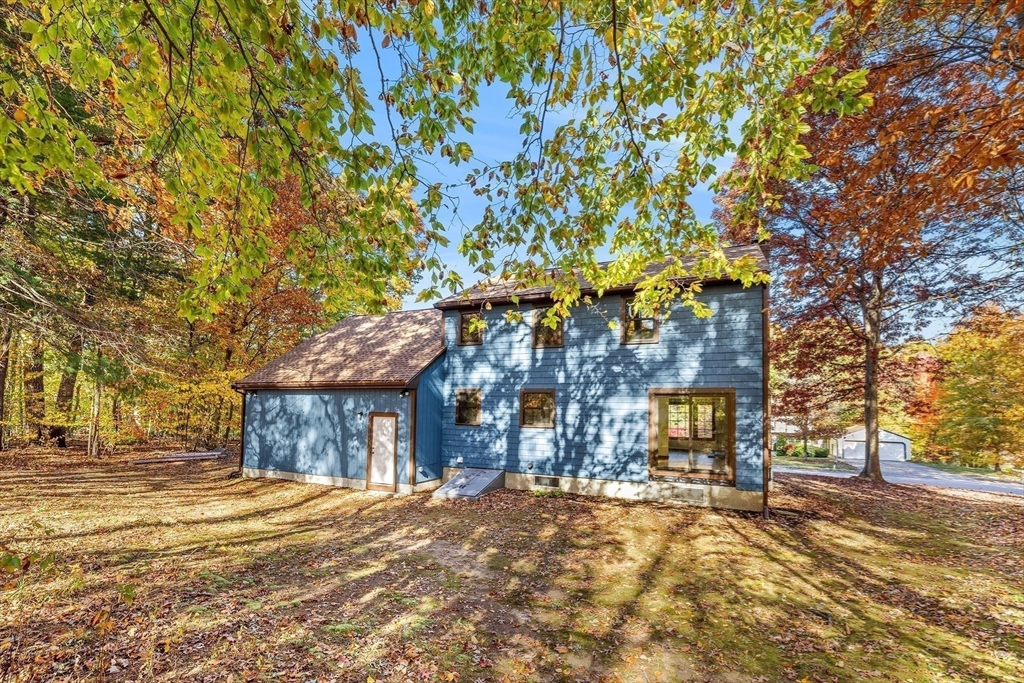 230 Irondequoit Road Franklin, MA 02038 - Photo 32 of 36 a front view of a house with a yard and garage