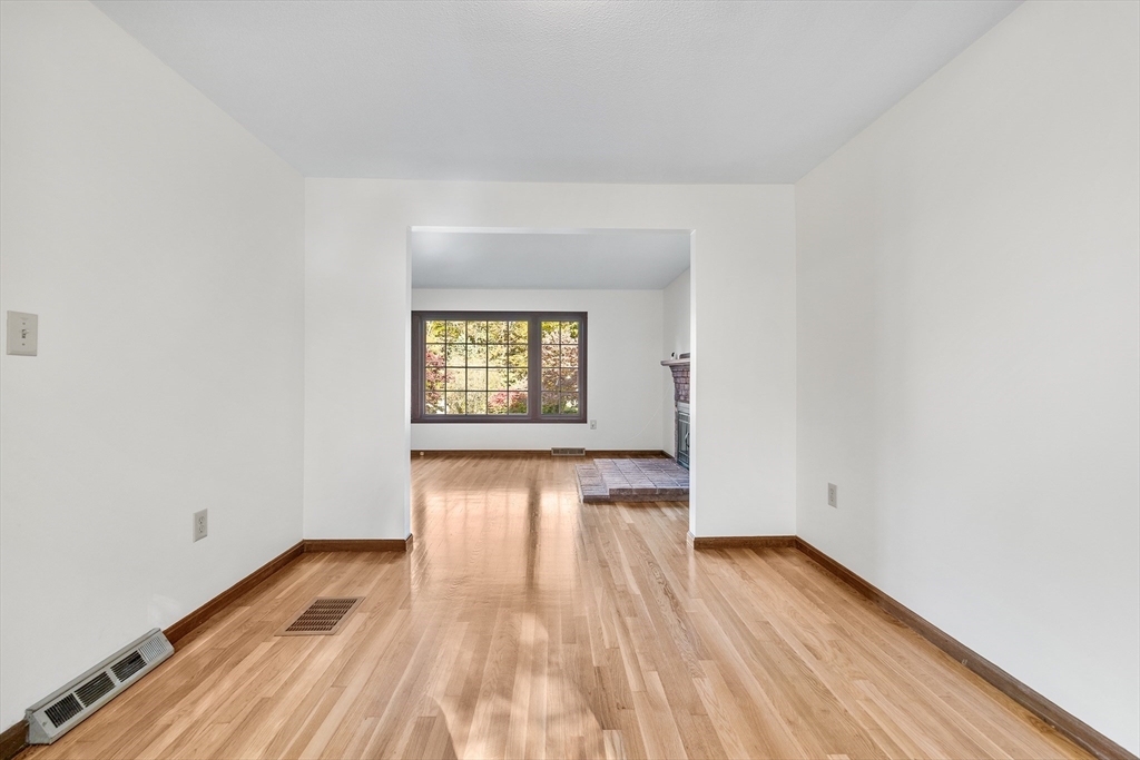 230 Irondequoit Road Franklin, MA 02038 - Photo 5 of 36 a view of an empty room and wooden floor