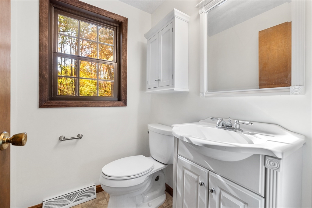 230 Irondequoit Road Franklin, MA 02038 - Photo 10 of 36 a bathroom with a sink toilet and a mirror