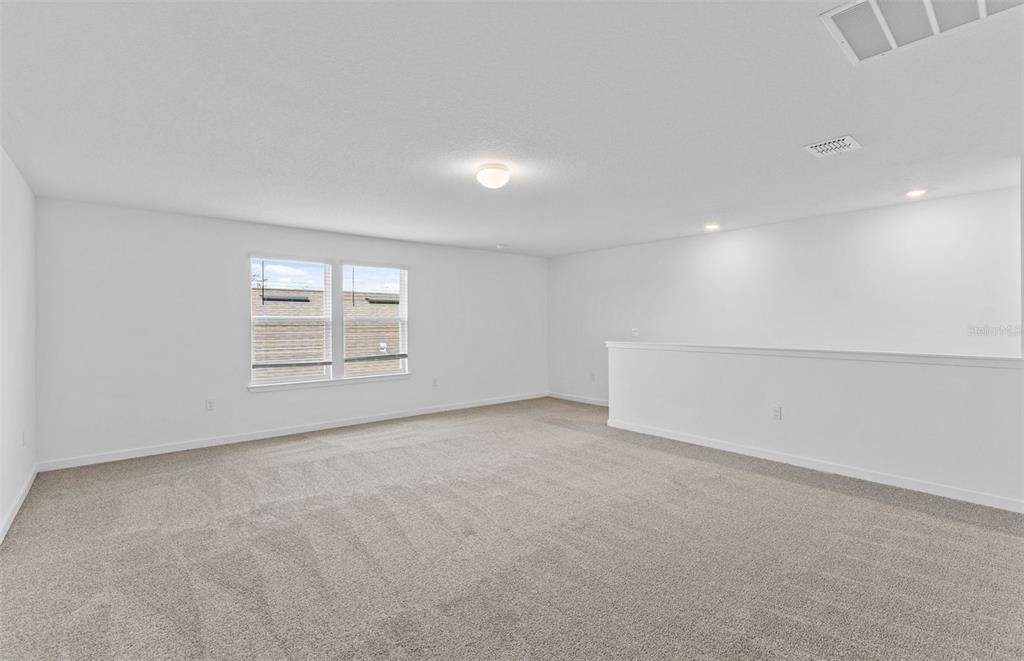 6909 Southwest 90th Place Ocala, FL 34476 - Photo 13 of 20 an empty room with windows