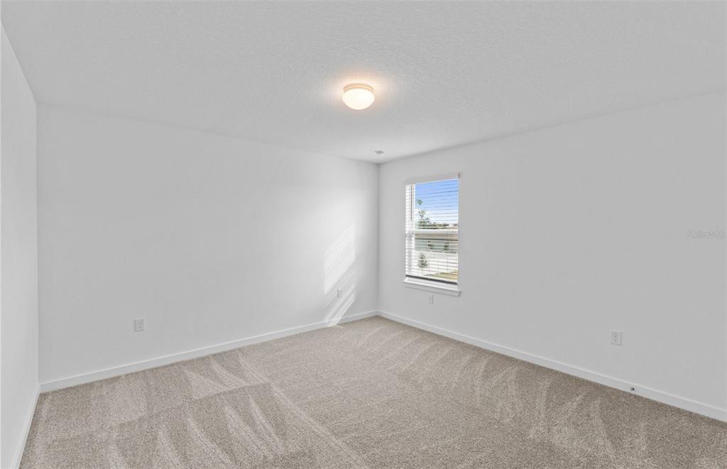 6909 Southwest 90th Place Ocala, FL 34476 - Photo 14 of 20 an empty room with a window