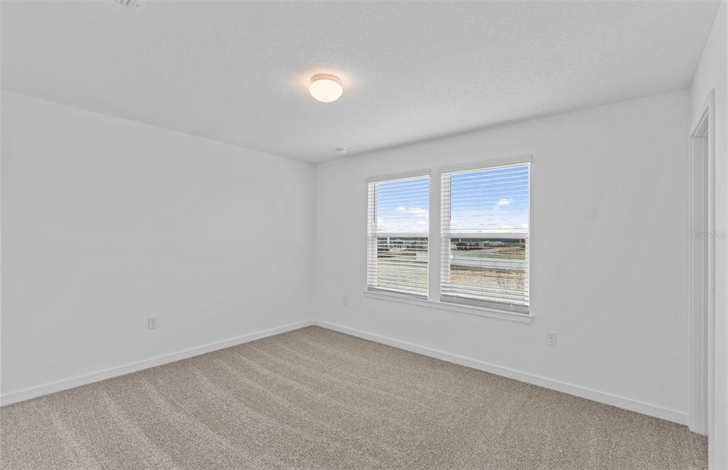 6909 Southwest 90th Place Ocala, FL 34476 - Photo 15 of 20 an empty room with a window