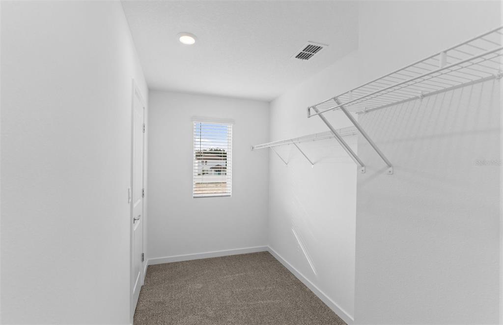 6909 Southwest 90th Place Ocala, FL 34476 - Photo 16 of 20 a view of small space with racks on the wall