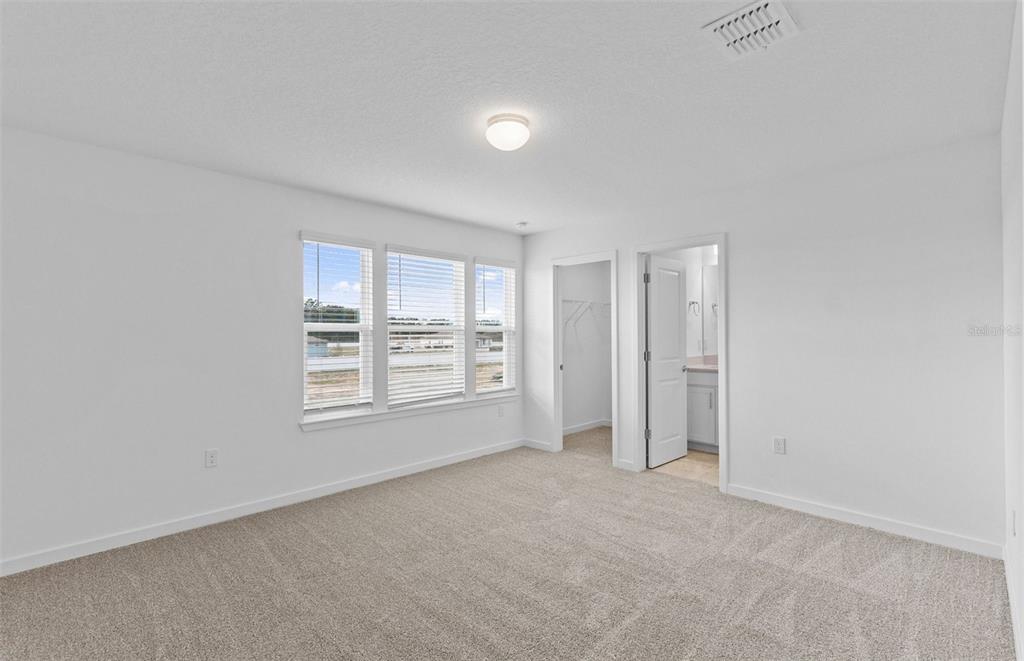 6909 Southwest 90th Place Ocala, FL 34476 - Photo 17 of 20 an empty room with windows