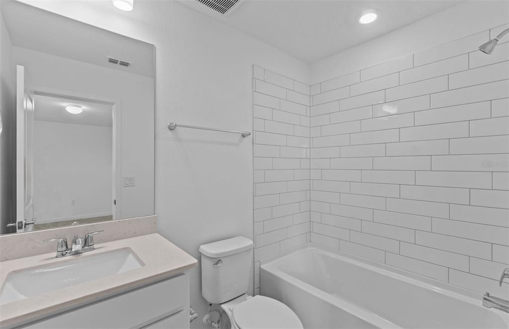 6909 Southwest 90th Place Ocala, FL 34476 - Photo 18 of 20 a bathroom with a bathtub and sink