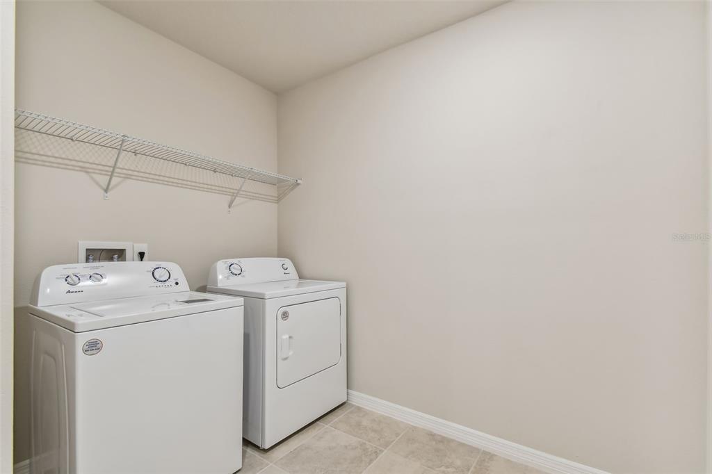 6909 Southwest 90th Place Ocala, FL 34476 - Photo 22 of 23 a utility room with dryer and washer