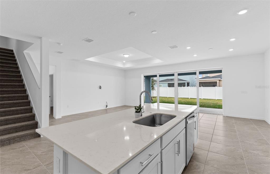 6909 Southwest 90th Place Ocala, FL 34476 - Photo 4 of 20 a kitchen with stainless steel appliances a sink and a refrigerator