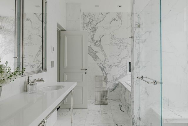 a bathroom with a sink and shower