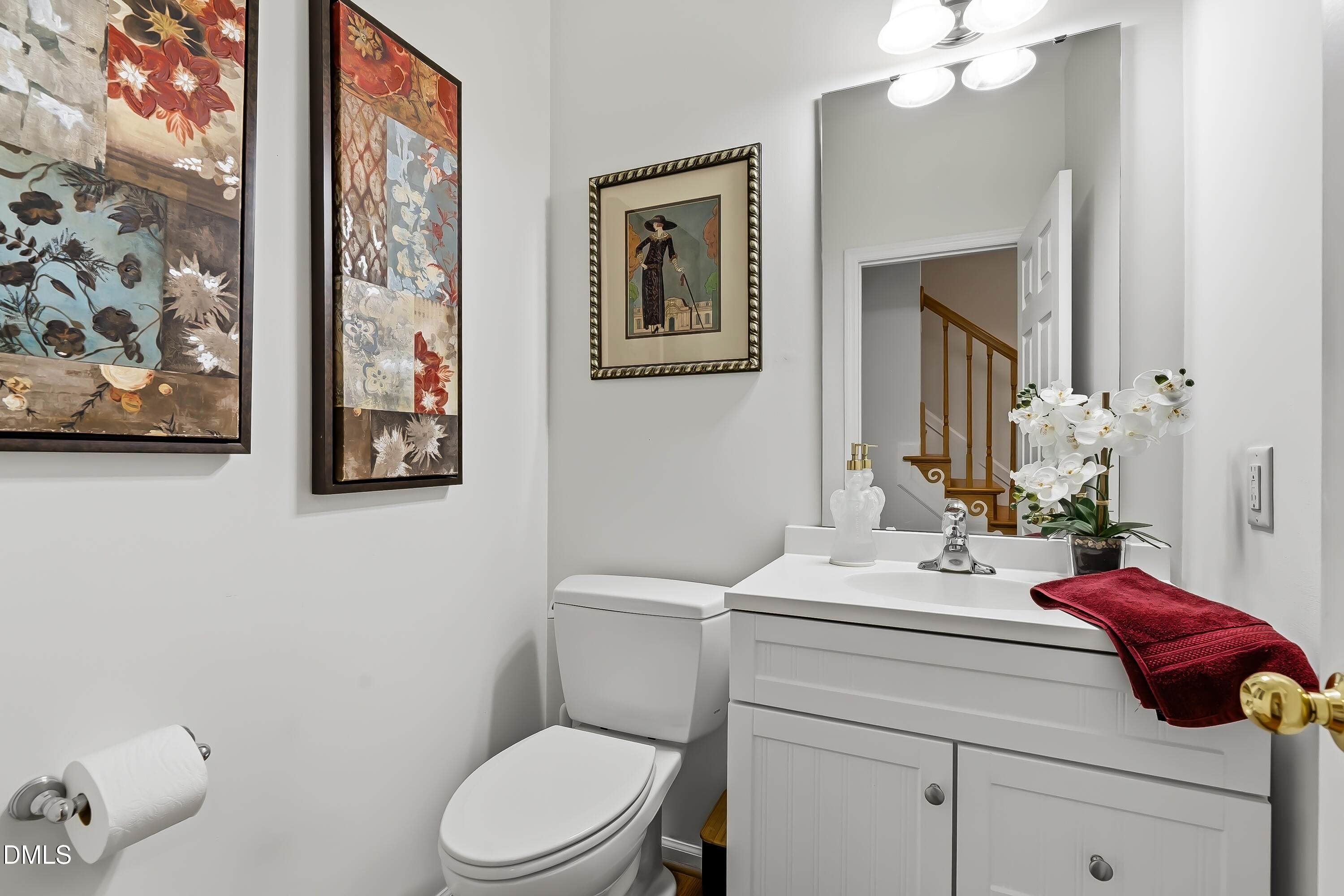 1214 Halcyon Place Rougemont, NC 27572 - Photo 8 of 69 a bathroom with a toilet a sink and mirror