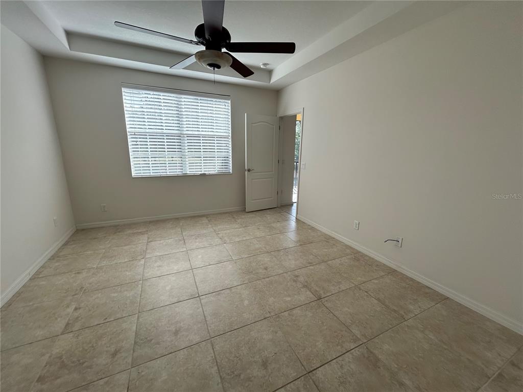 8143 Miramar Way, Unit 8143 Lakewood Ranch, FL 34202 - Photo 11 of 18 a view of an empty room with a window