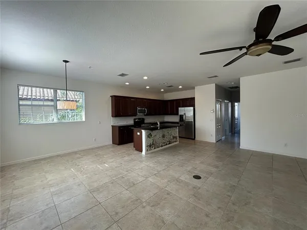 a view of kitchen with furniture and a window