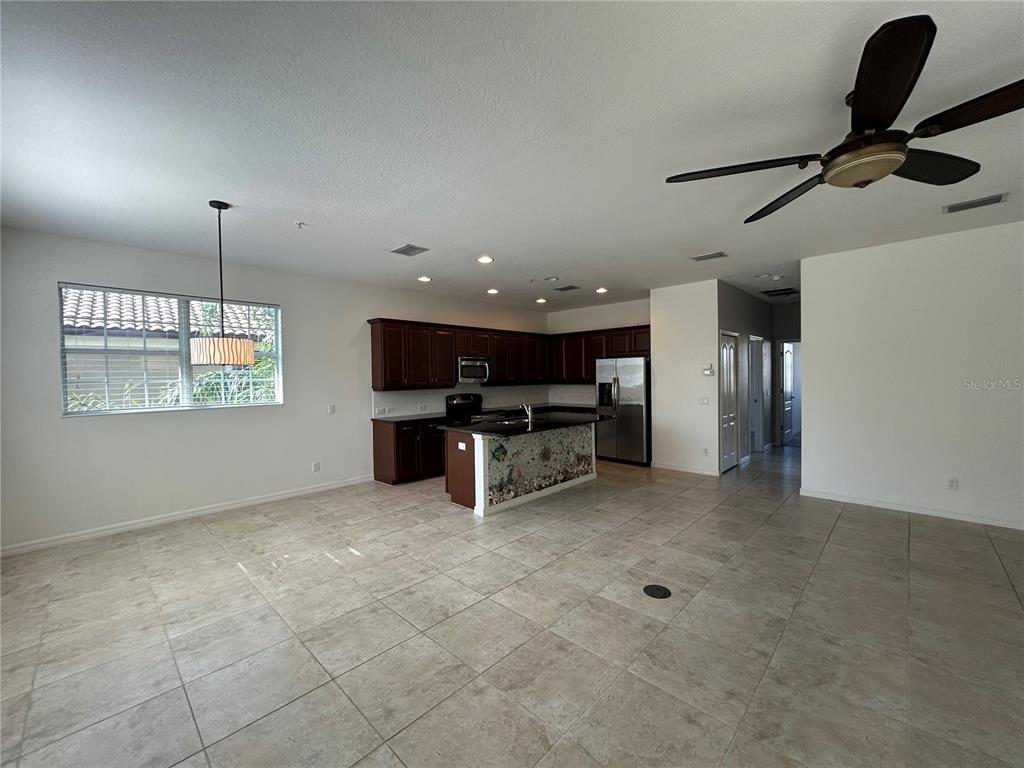 8143 Miramar Way, Unit 8143 Lakewood Ranch, FL 34202 - Photo 6 of 18 a view of kitchen with furniture and a window
