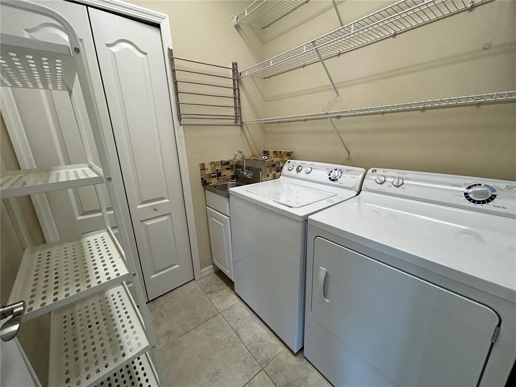 8143 Miramar Way, Unit 8143 Lakewood Ranch, FL 34202 - Photo 10 of 18 a utility room with dryer and washer