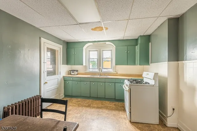 a bathroom with a sink mirror and a bathtub