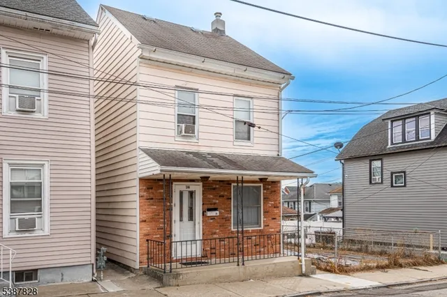 a front view of a house with glass windows