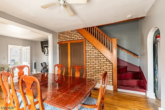 a view of front door with dining room and stairs