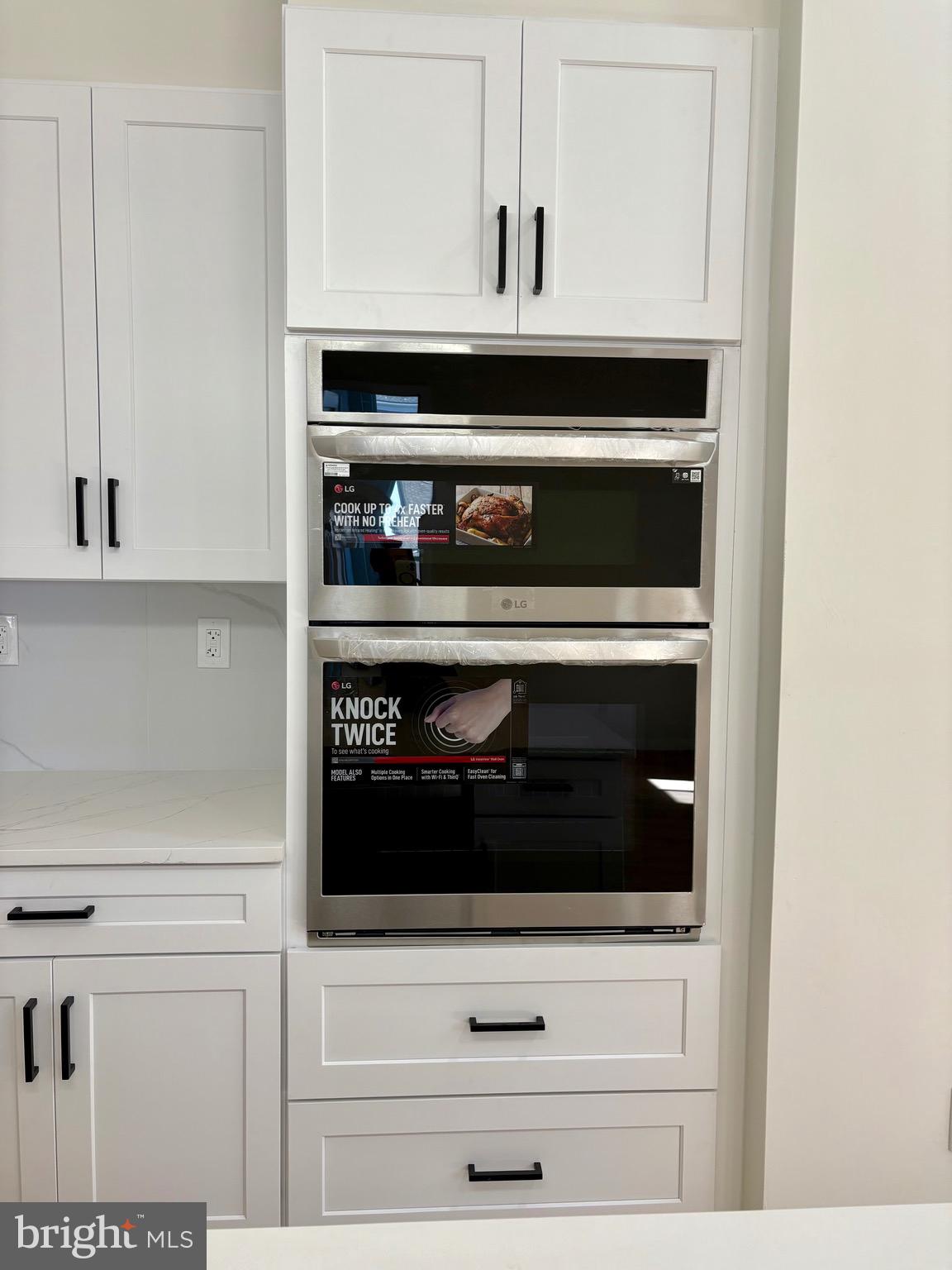 865 West Lancaster Avenue Bryn Mawr, PA 19010 - Photo 4 of 16 a close view of cabinet and microwave
