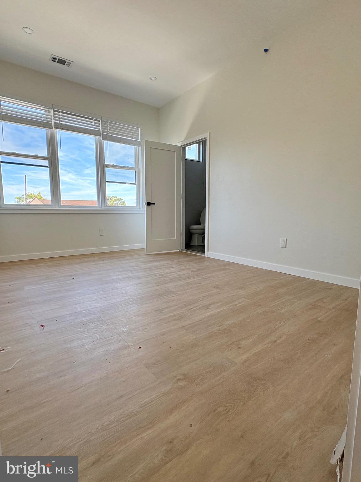 865 West Lancaster Avenue Bryn Mawr, PA 19010 - Photo 8 of 16 wooden floor in an empty room with a window