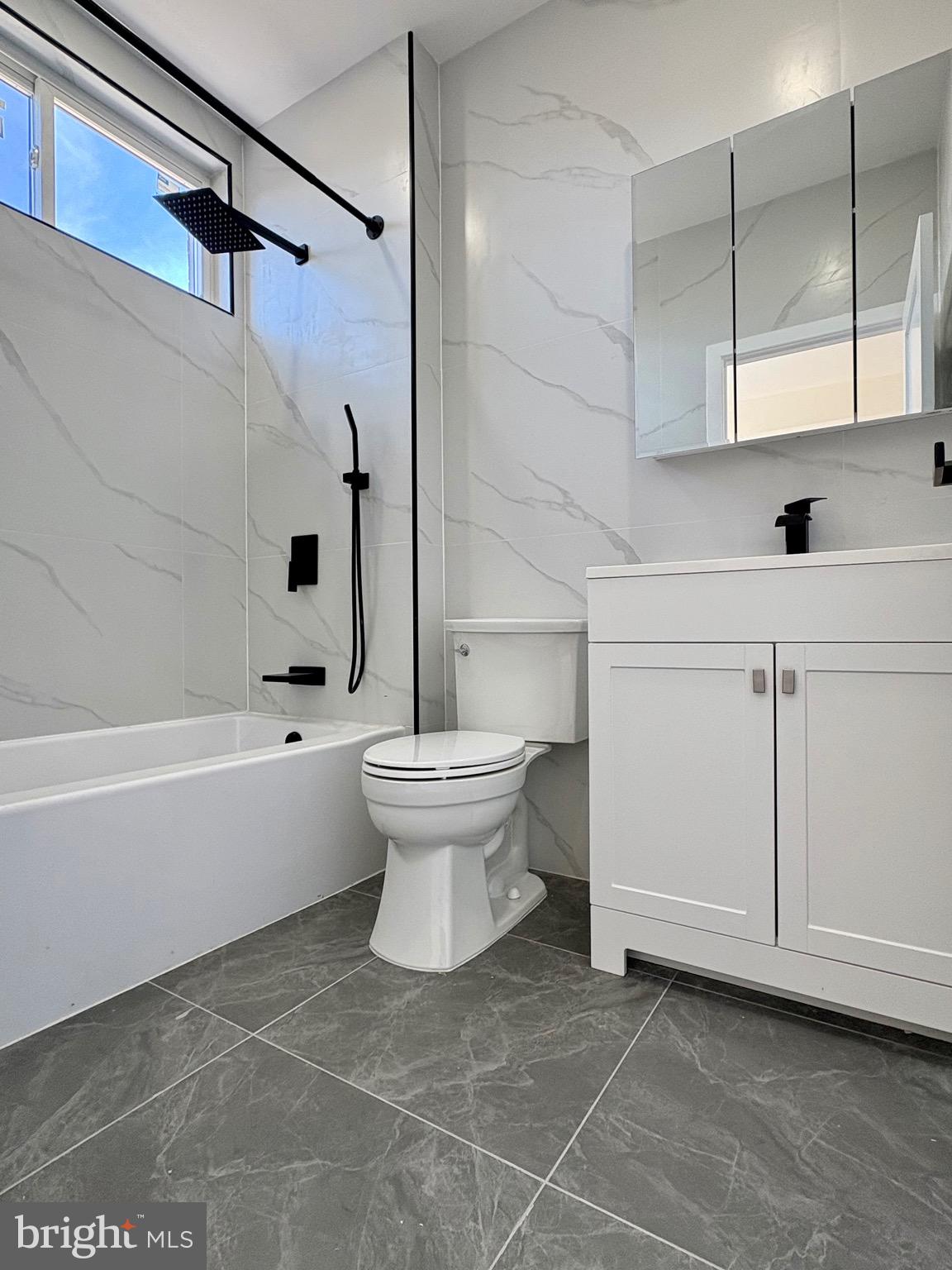 865 West Lancaster Avenue Bryn Mawr, PA 19010 - Photo 10 of 16 a bathroom with a white toilet and a bathtub