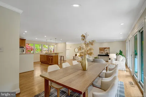 a kitchen with a table and chairs in it