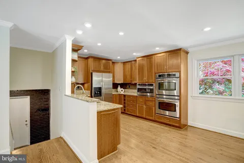 a bedroom with a bed and a night stand