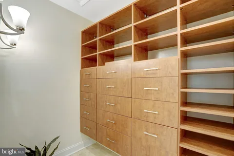 a bathroom with a sink vanity and a mirror