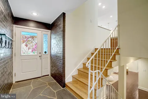 a view of entryway with wooden floor