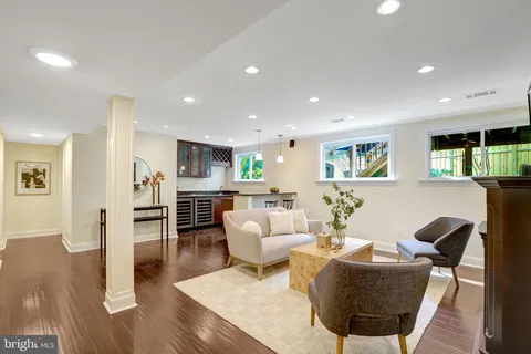 a kitchen with a table chairs stove and microwave