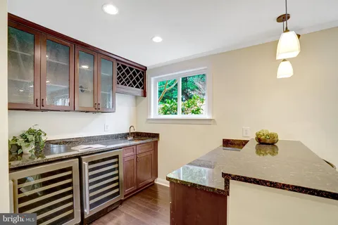a bathroom with a sink a bathtub and a mirror