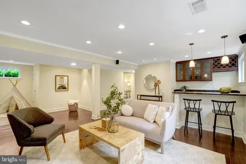 a backyard of a house with a table and chairs