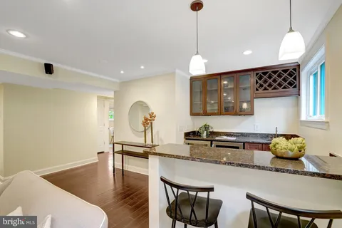 a view of a backyard with plants and a patio