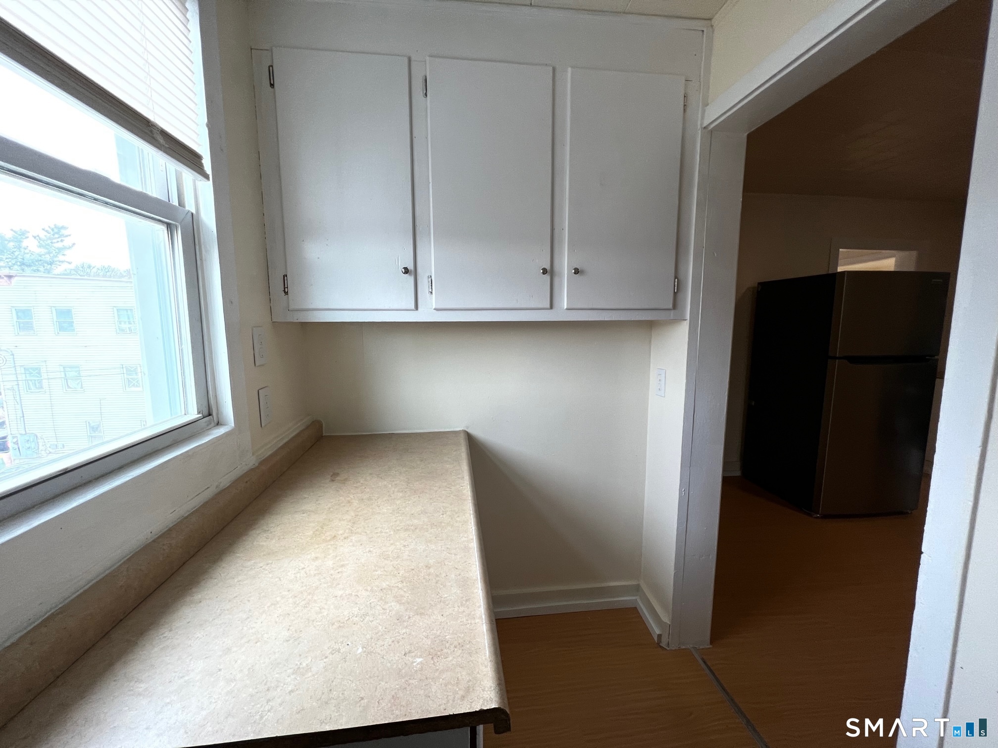 62 North Leonard Street Waterbury, CT 06708 - Photo 6 of 13 a view of walk in closet with window