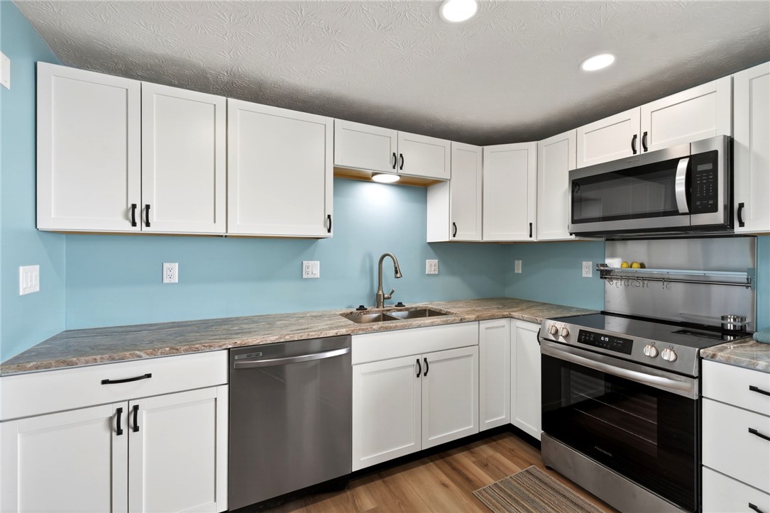 5975 Rosalie Road Dayton, OH 45424 - Photo 11 of 48 This thoughtfully designed kitchen offers modern amenities and a serene ambiance.