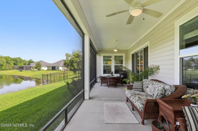 a view of a backyard with sitting area