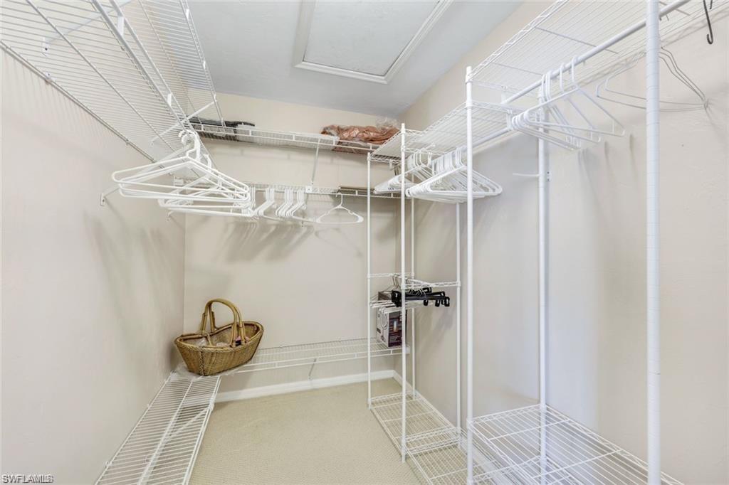 6555 Valen Way, Unit G201 Naples, FL 34108 - Photo 13 of 28 a view of a room with a chandelier