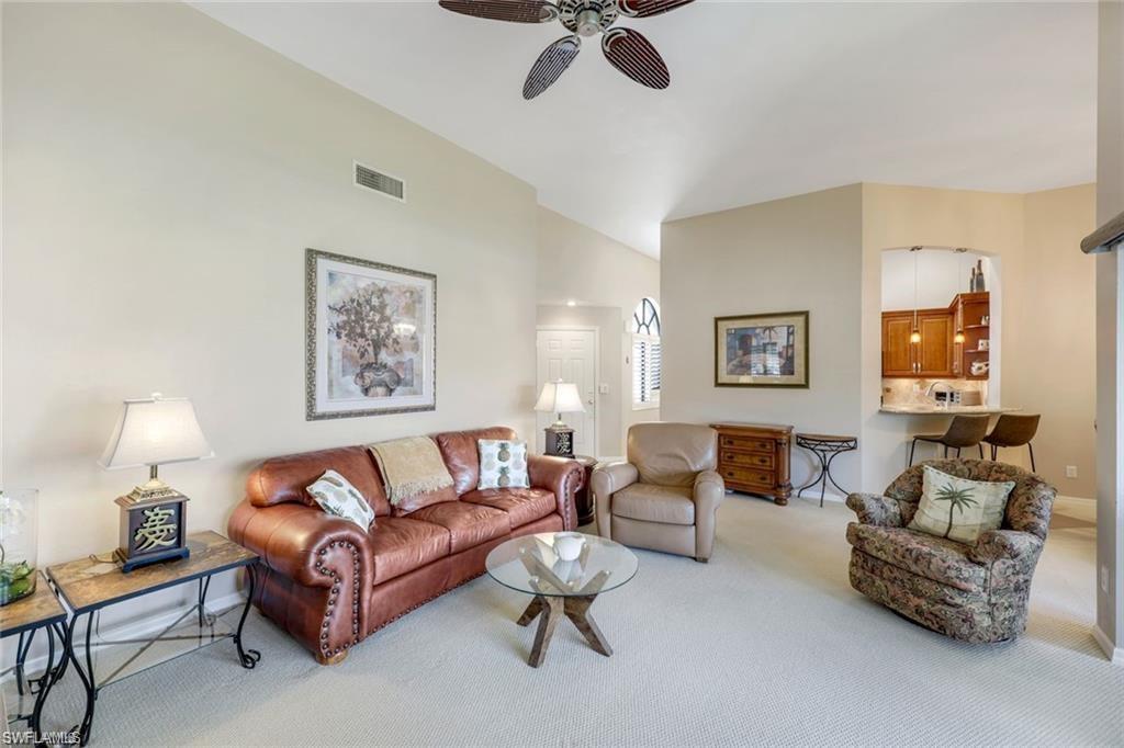 6555 Valen Way, Unit G201 Naples, FL 34108 - Photo 21 of 28 a living room with furniture and a potted plant