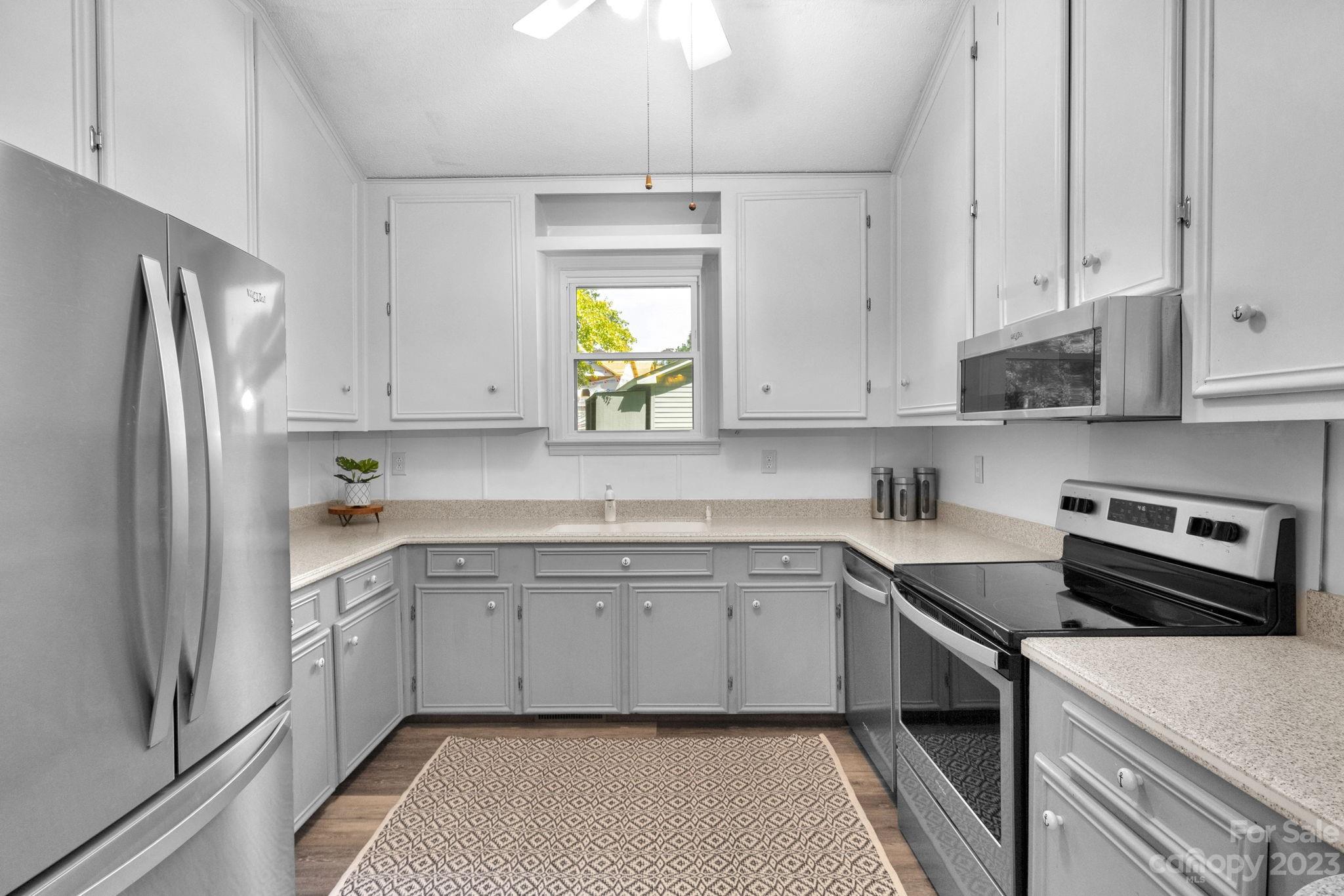 2075 Rolling Hills Road Ridgeway, SC 29130 - Photo 11 of 40 a kitchen with a sink stove and refrigerator