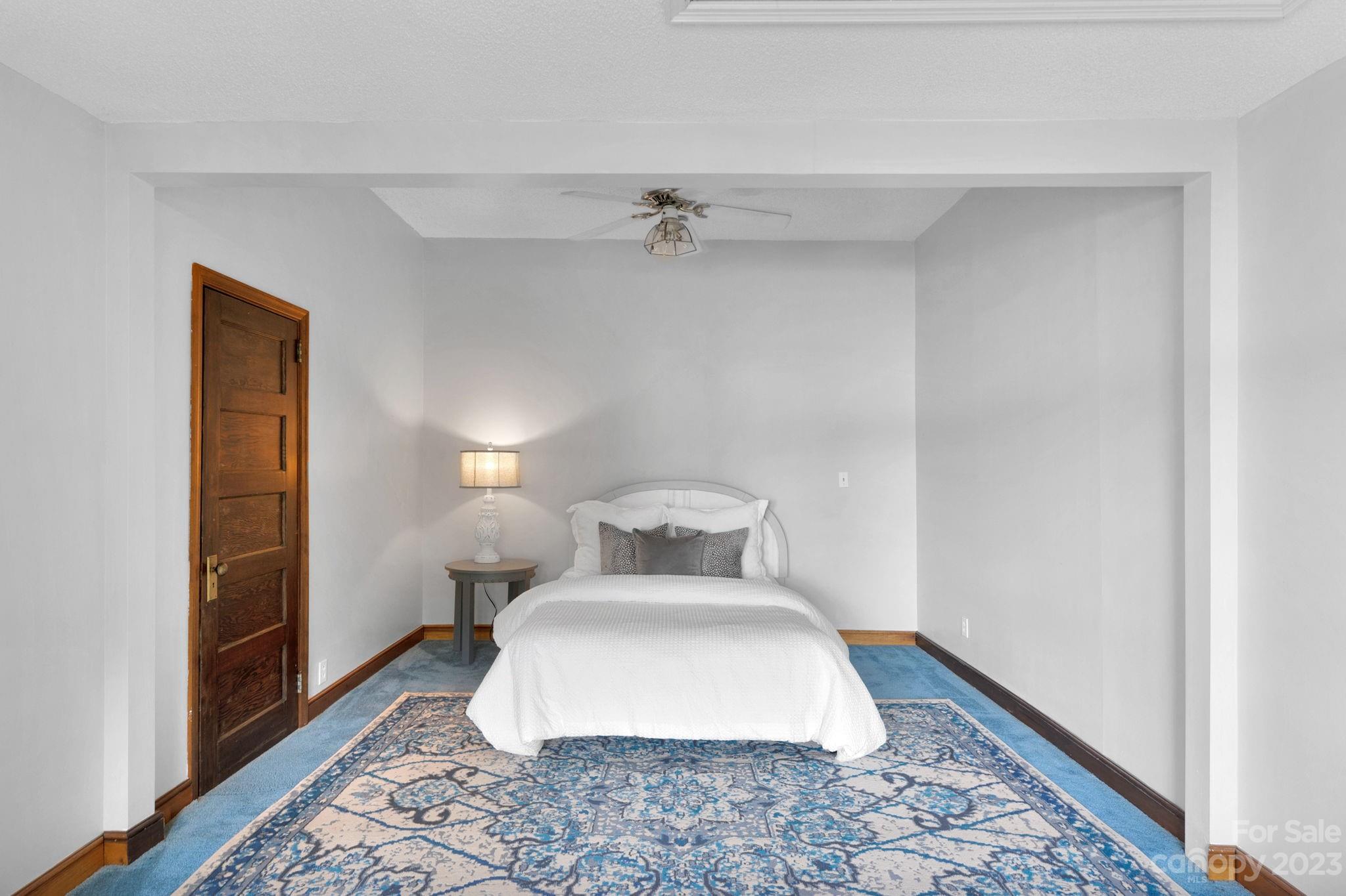 2075 Rolling Hills Road Ridgeway, SC 29130 - Photo 15 of 40 a bedroom with a bed and wooden floor