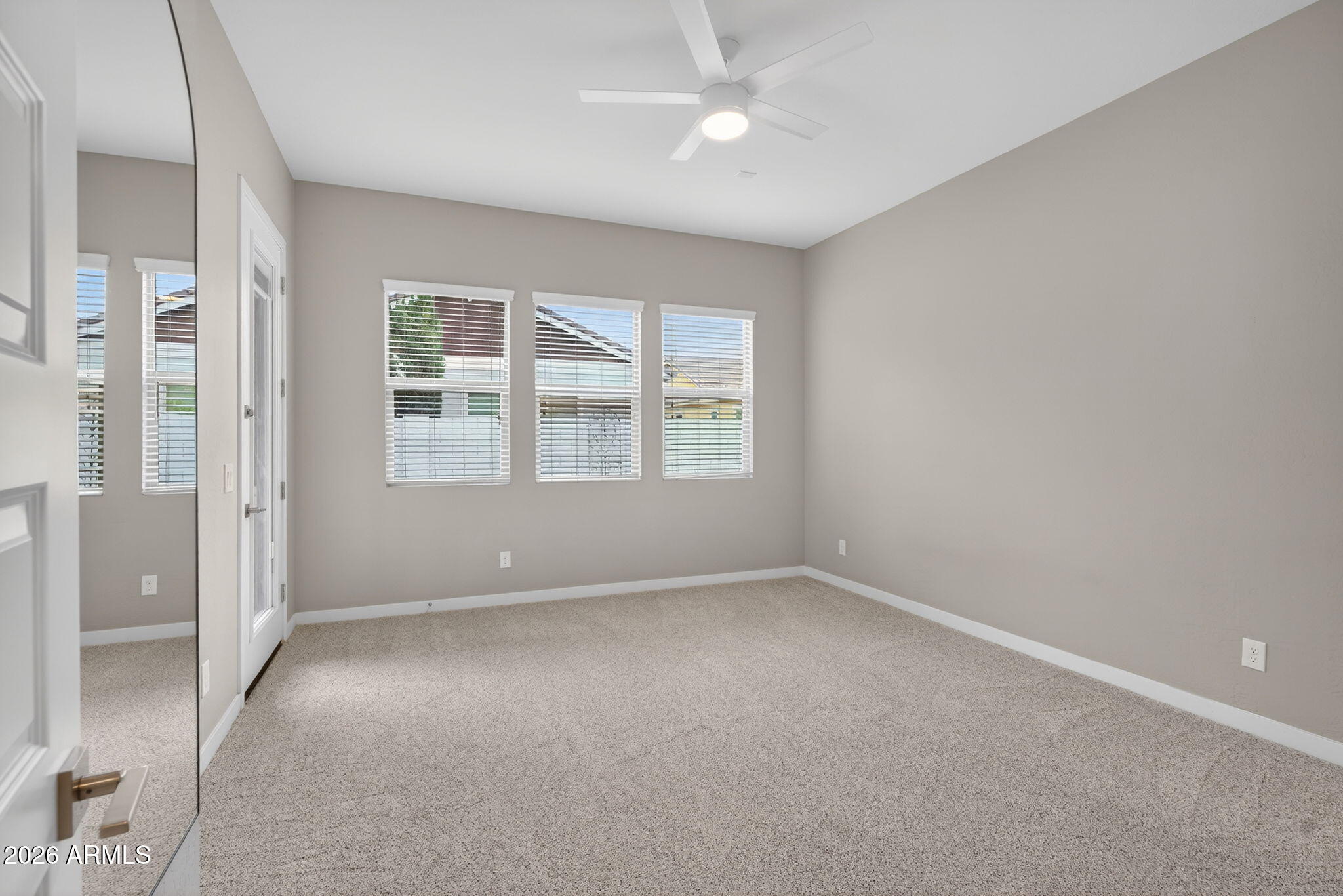 3075 East Appaloosa Road Gilbert, AZ 85296 - Photo 15 of 41 an empty room with windows and closet