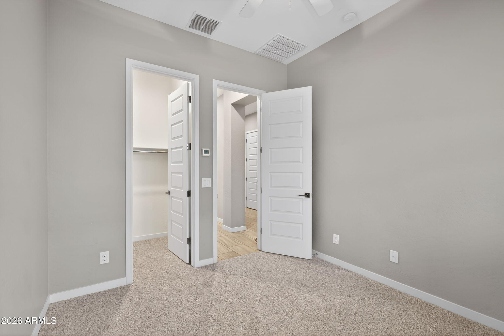 3075 East Appaloosa Road Gilbert, AZ 85296 - Photo 21 of 41 an empty room with closet and a bathroom