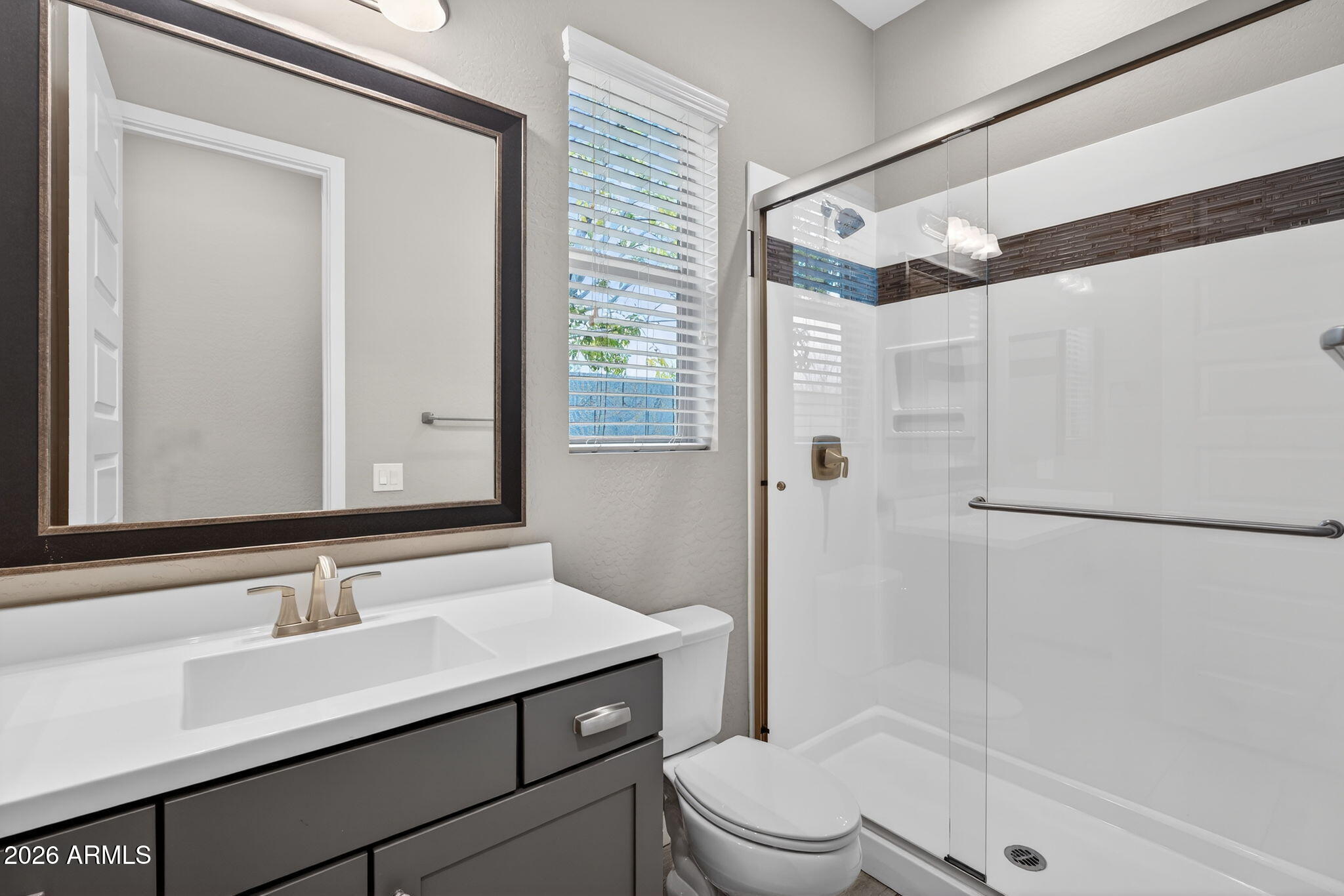 3075 East Appaloosa Road Gilbert, AZ 85296 - Photo 23 of 41 a bathroom with a sink toilet and shower