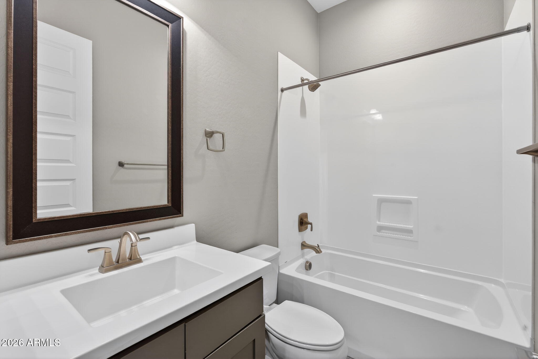 3075 East Appaloosa Road Gilbert, AZ 85296 - Photo 27 of 41 a bathroom with a sink a toilet and shower