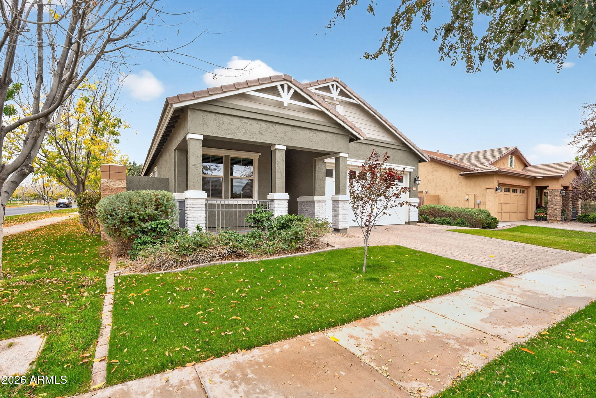 3075 East Appaloosa Road Gilbert, AZ 85296 - Photo 2 of 41 a front view of a house with a yard