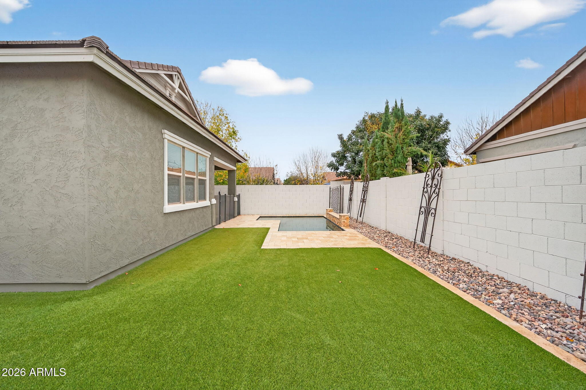 3075 East Appaloosa Road Gilbert, AZ 85296 - Photo 36 of 41 a view of an house with backyard space and a lake view