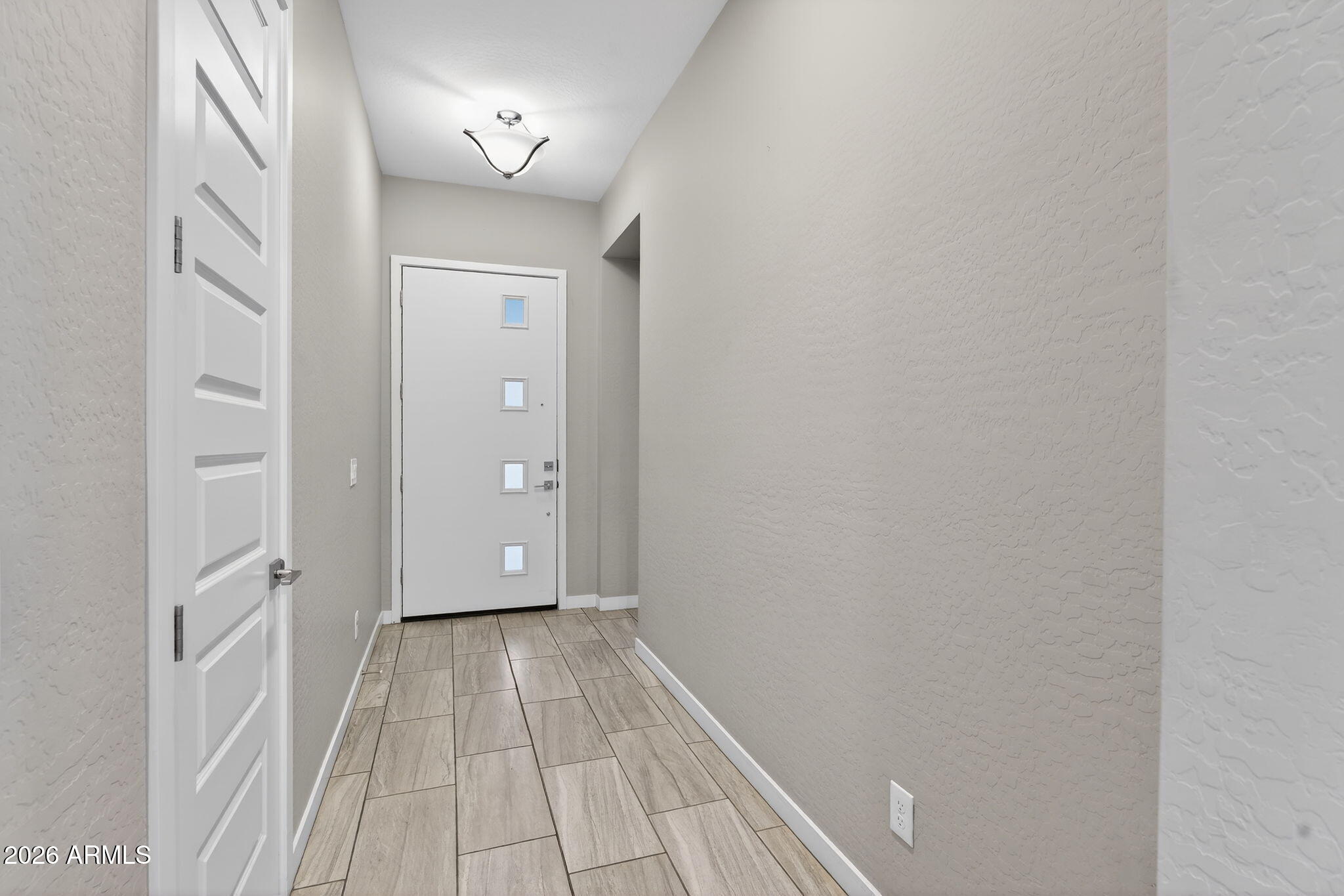 3075 East Appaloosa Road Gilbert, AZ 85296 - Photo 5 of 41 a view of a hallway with wooden floor