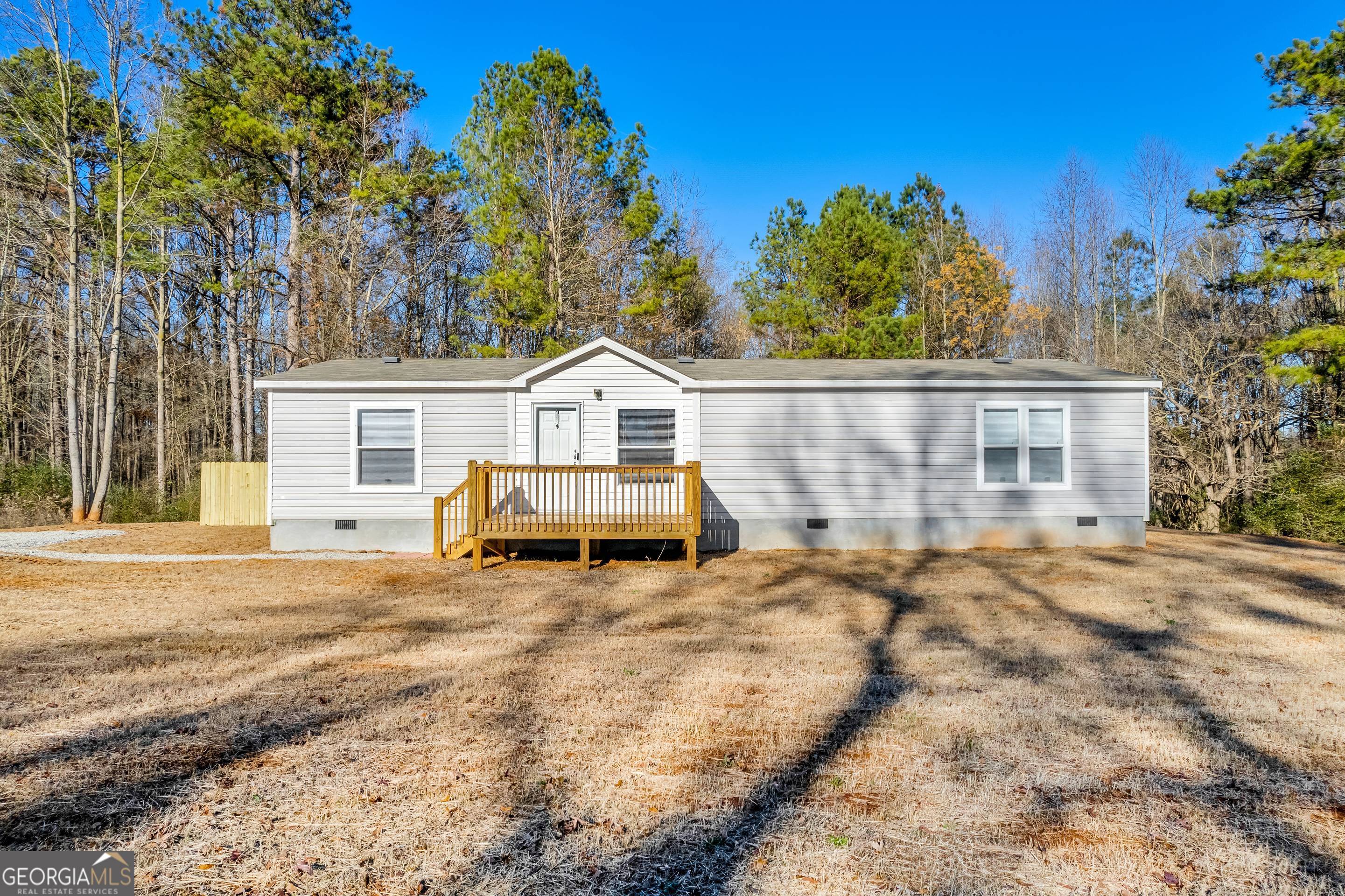 747 Fowler-Freeman Road Danielsville, GA 30633 - Photo 1 of 1 a house with trees in front of it