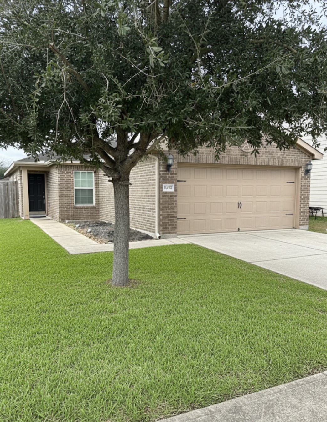 11230 Hall Ranch Court Houston, TX 77075 - Photo 20 of 21 a front view of a house with garden