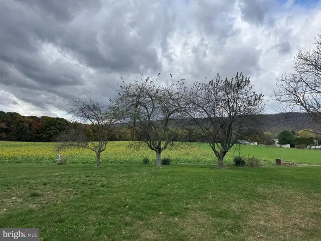 a view of a golf course with a lake