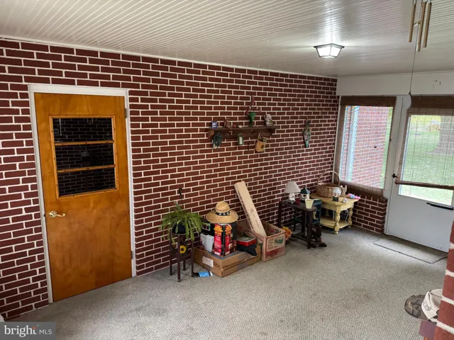 a living room with furniture fireplace and a flat screen tv