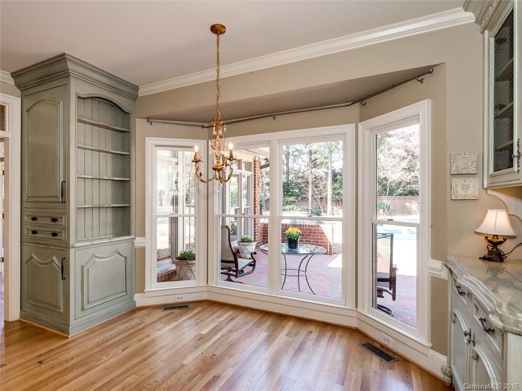 4822 Nora's Path Road Charlotte, NC 28226 - Photo 11 of 24 a view of an empty room with window and wooden floor